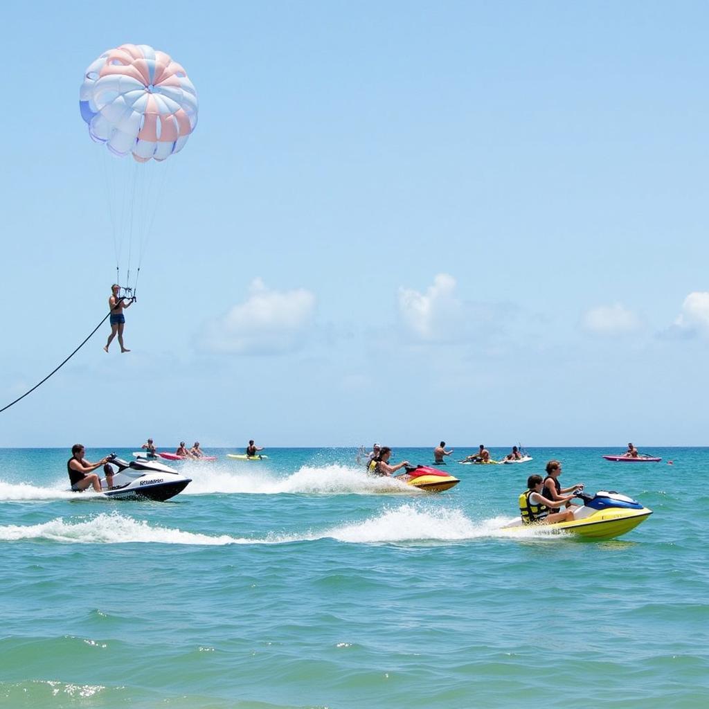 Du khách tham gia các hoạt động thể thao biển sôi động tại Coco Beach như mô tô nước, dù lượn, chèo thuyền kayak.